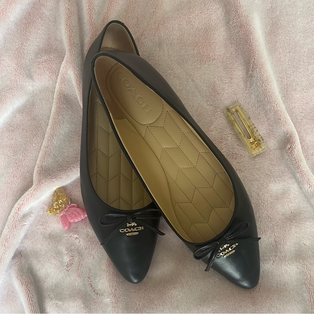 Black COACH flats w/ pointed toe and bow